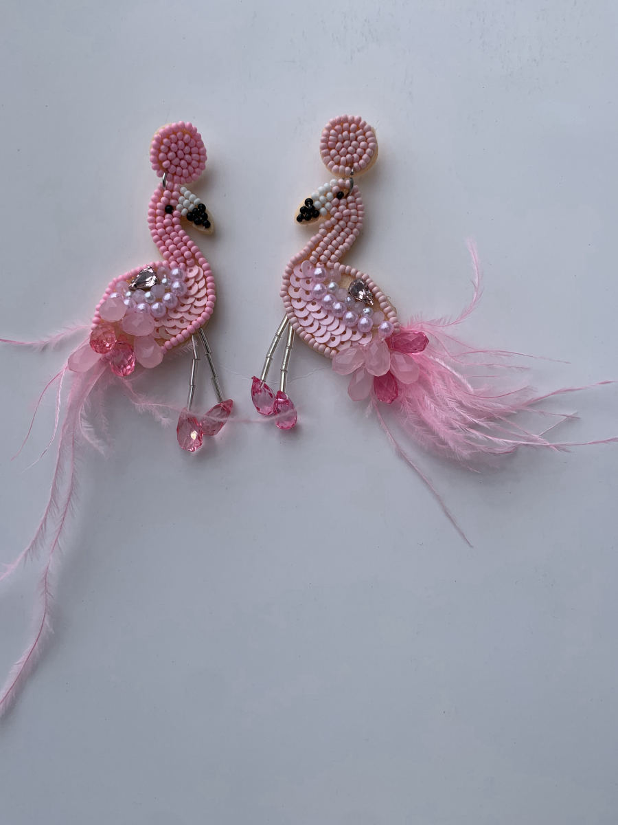 Beaded flamingo earrings in pink and white with sequin body, crystal foot drops, and real feather accent.