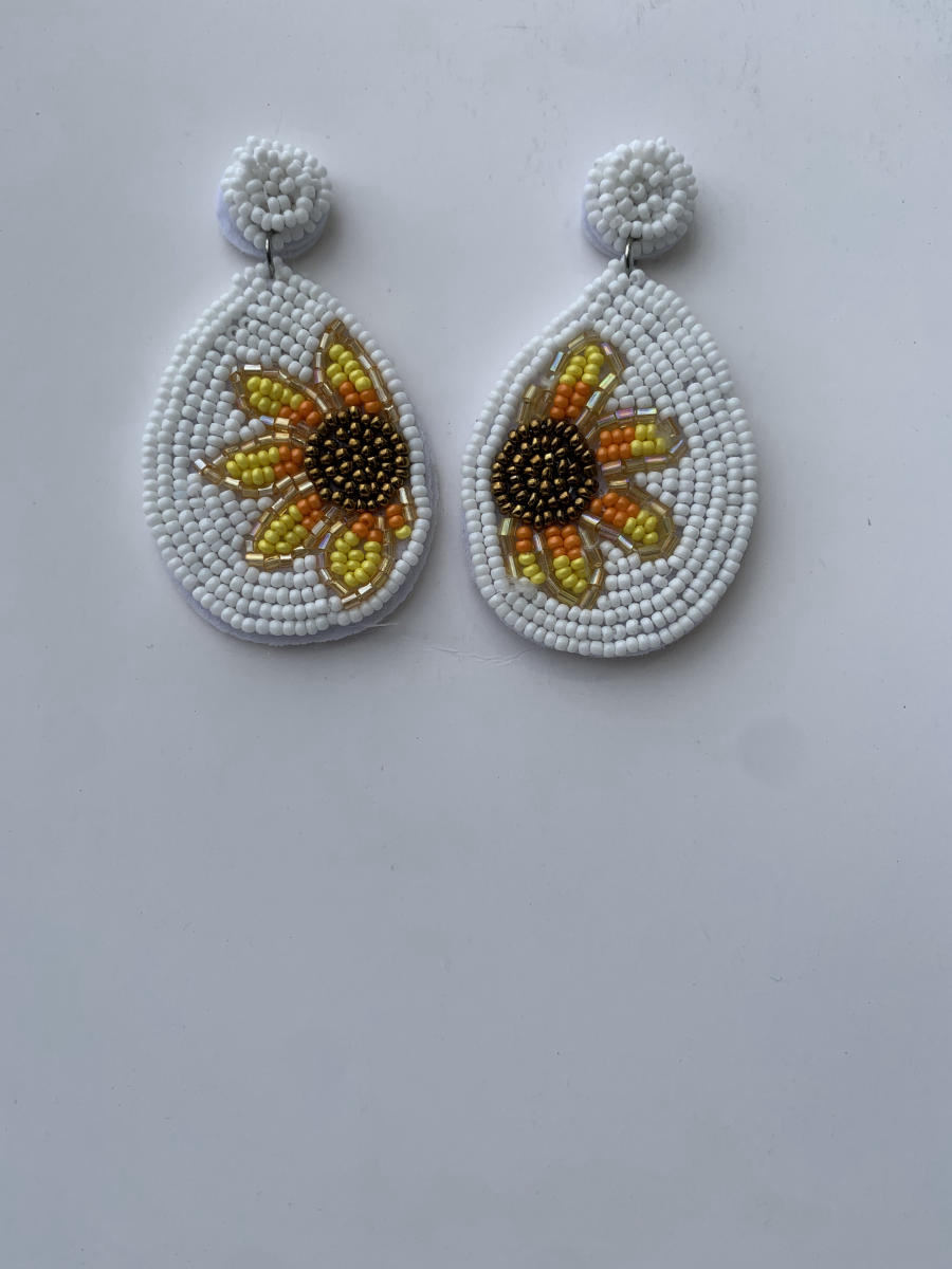Beaded teardrop earrings with sunflower motif in warm white and yellow seed beads, round disc stud top.