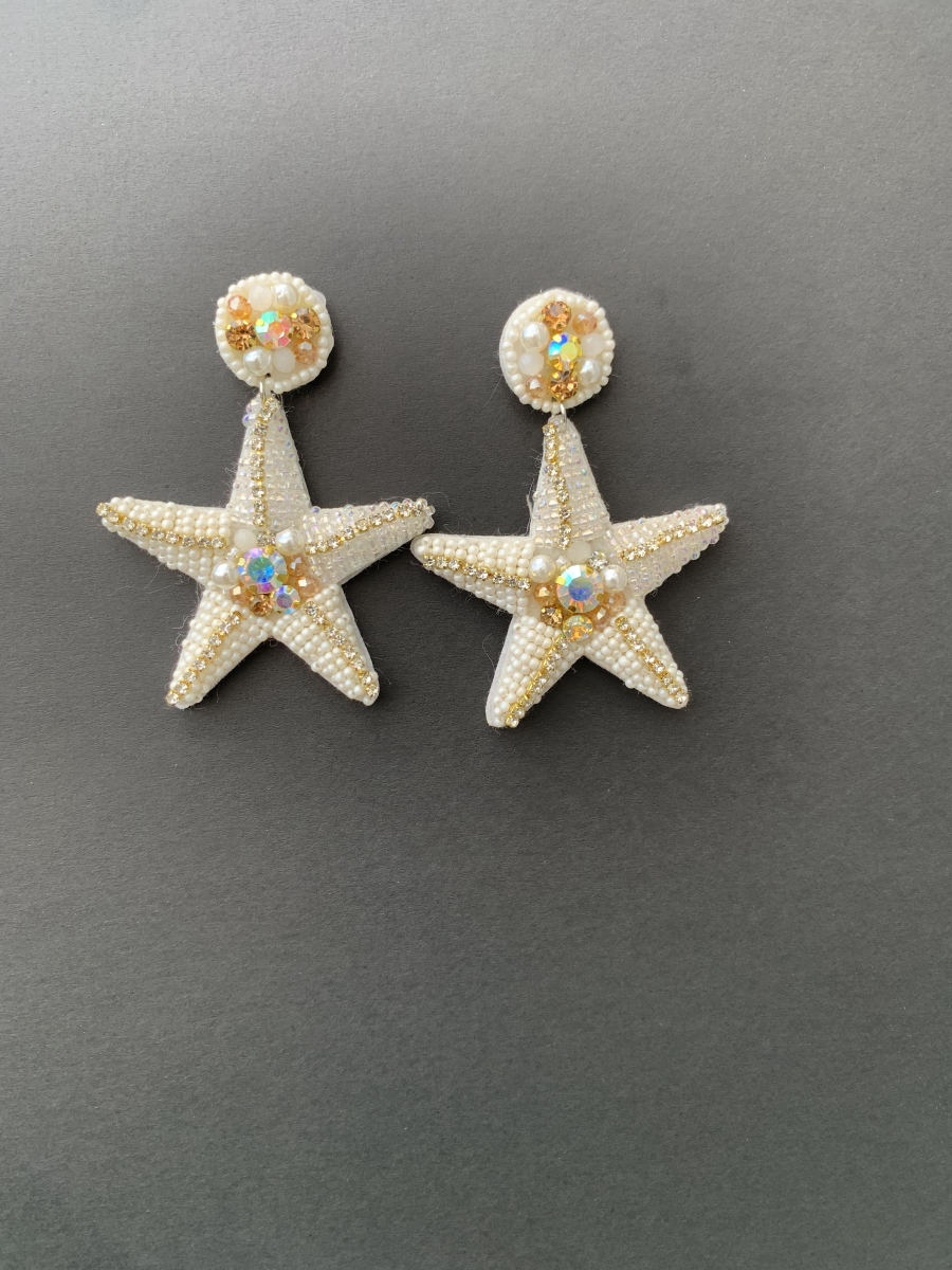 Large five-point starfish earrings in dense cream seed beads with AB crystal and rhinestone accents, crystal cluster stud top.