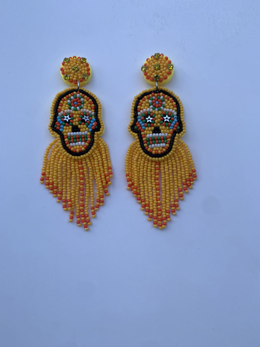 Beaded sugar skull earrings with colourful face and long yellow and orange seed bead fringe tassel.