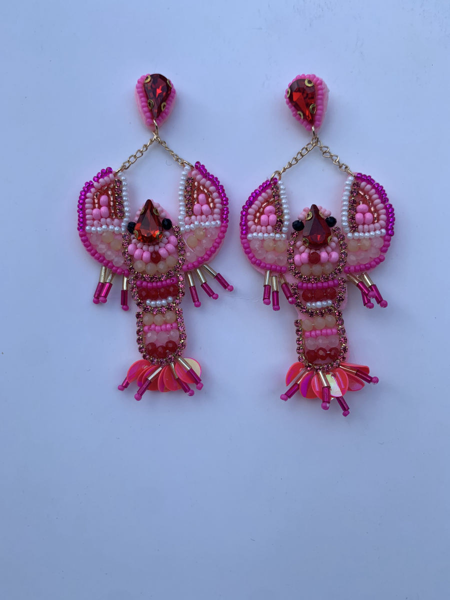 Beaded lobster earrings in fuchsia and pink with crystal body accents, sequin fan tail, and teardrop crystal stud on gold chain.