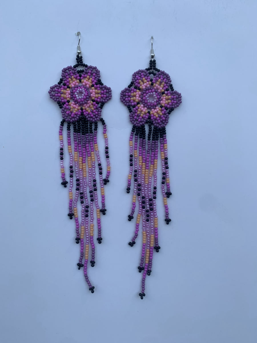 Long fringe earrings with purple and pink flower mandala on black ground, peach and mauve multi-strand fringe, wire hook.
