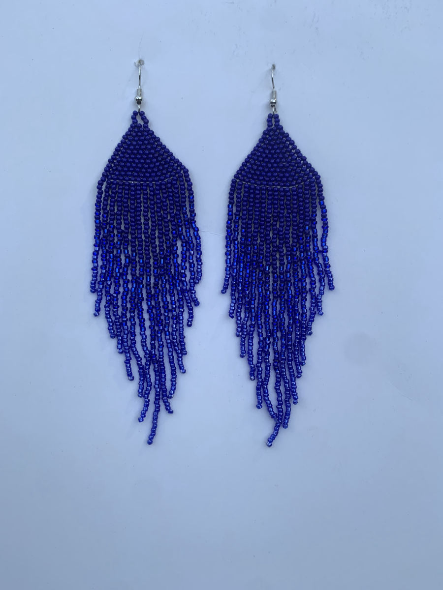 Long fringe earrings in deep royal blue seed beads with triangular top section and long cascading metallic shimmer strands, wire hook.