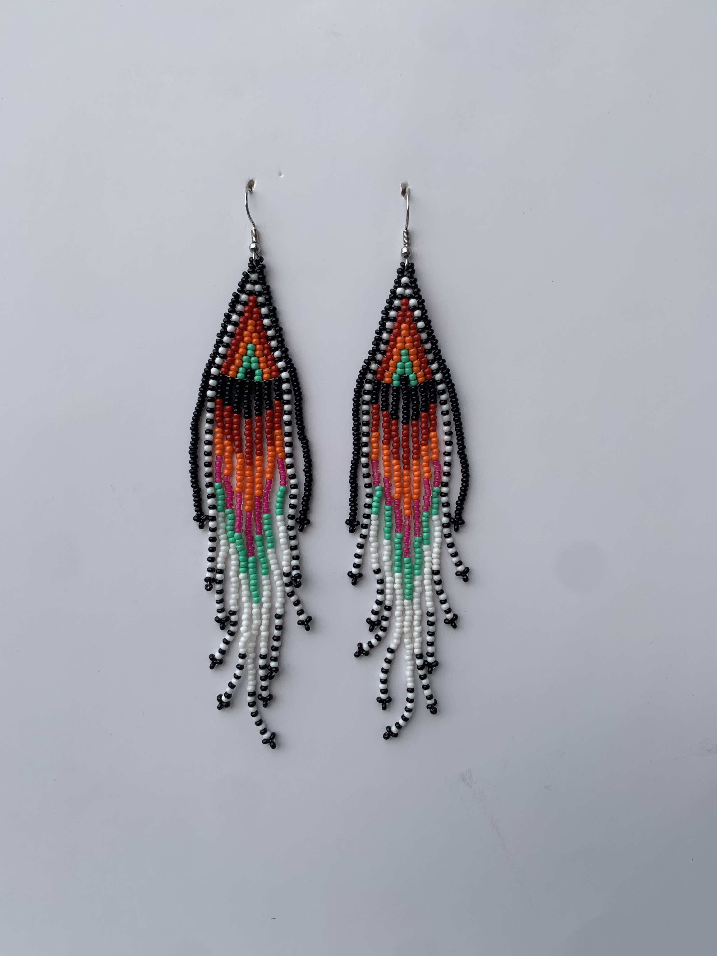Beyin Aztec Cascade — handmade black, orange, teal beaded fringe earrings by Rama, Ghana, Duncan BC