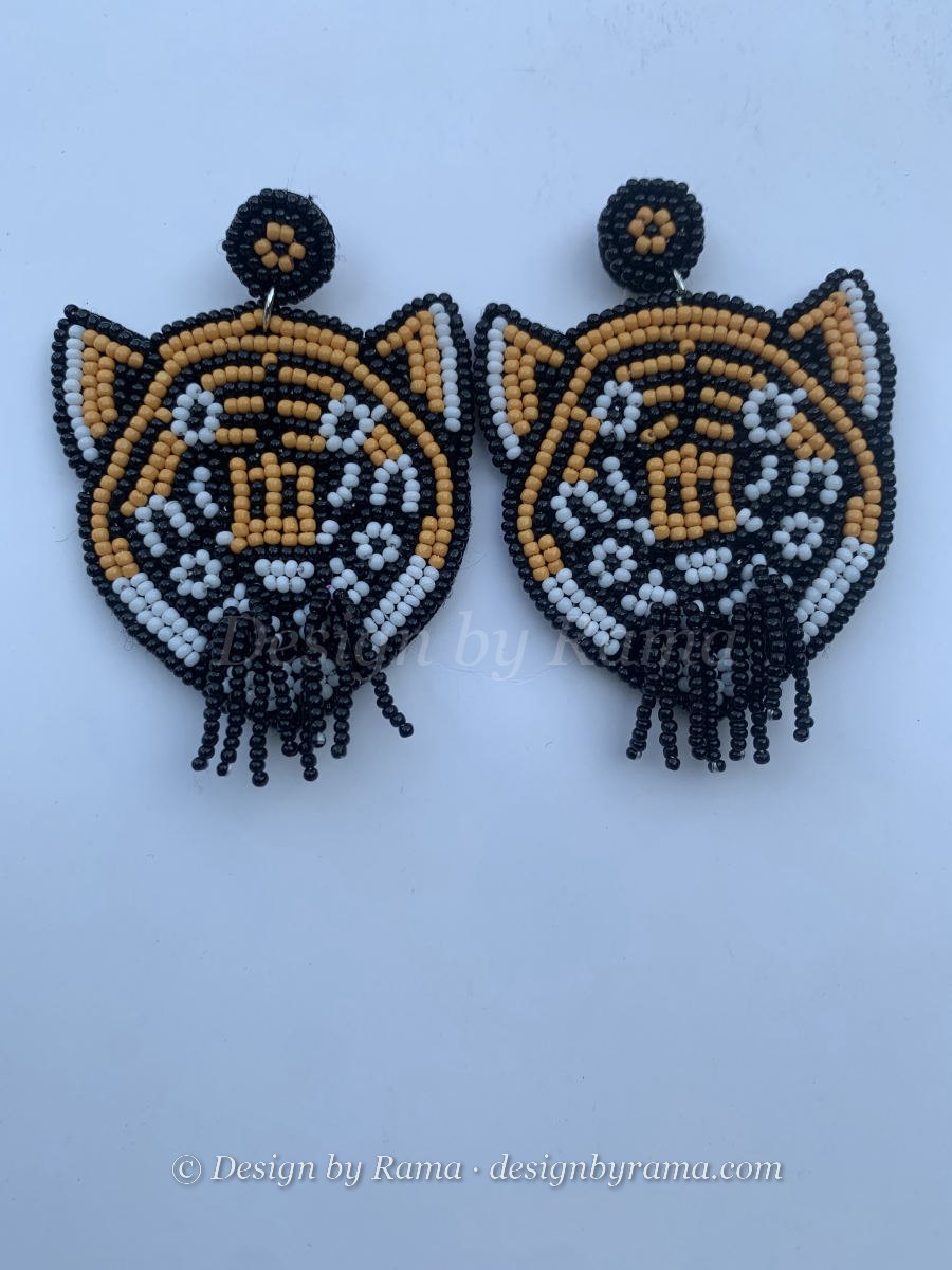 Akyem Tiger Face — handmade black, white, amber beaded portrait earrings by Rama, Ghana glass beads, Duncan BC