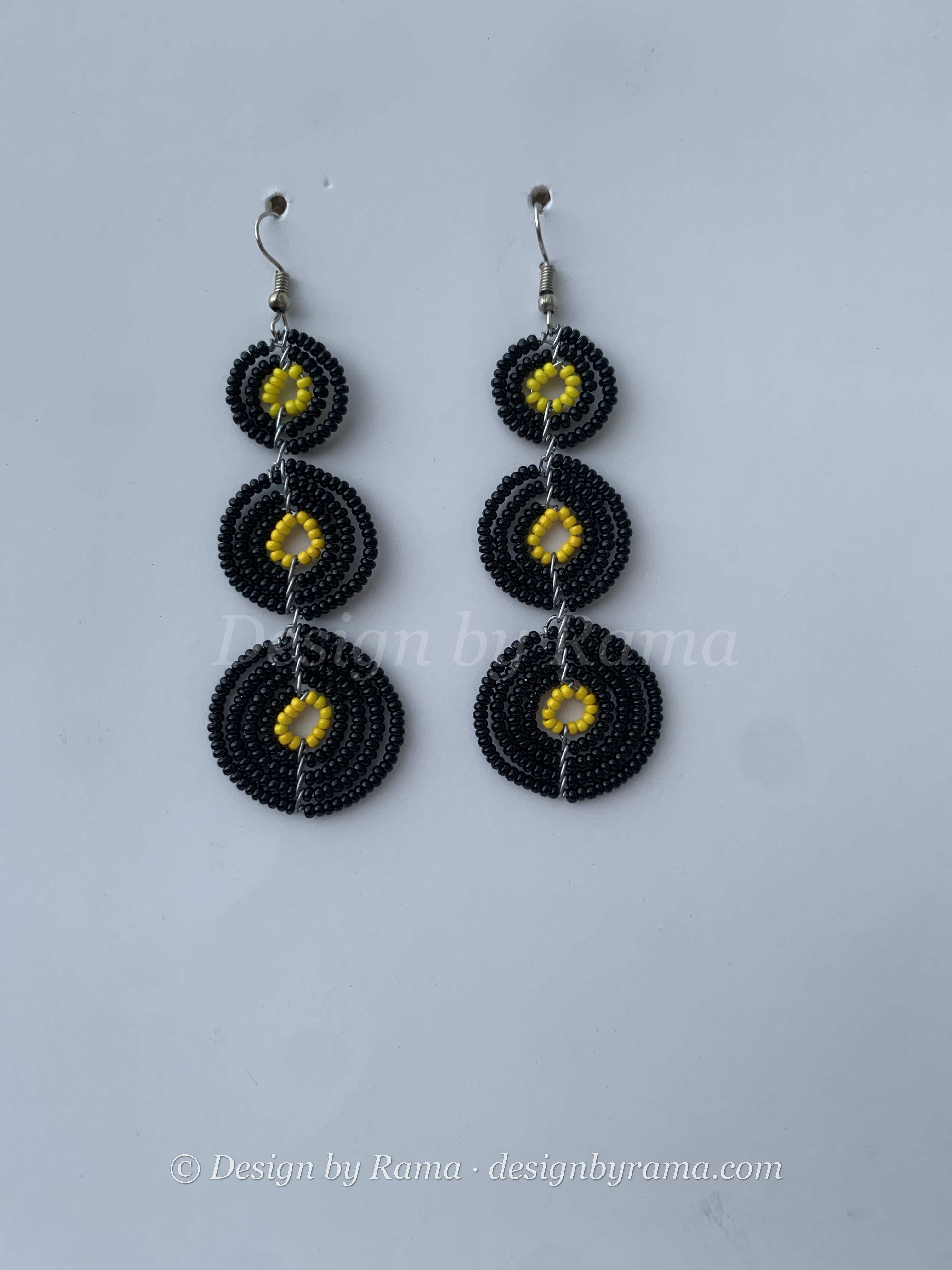 Donkorkrom Sun Discs — handmade black, gold beaded maasai earrings by Rama, Ghana glass beads, Duncan BC