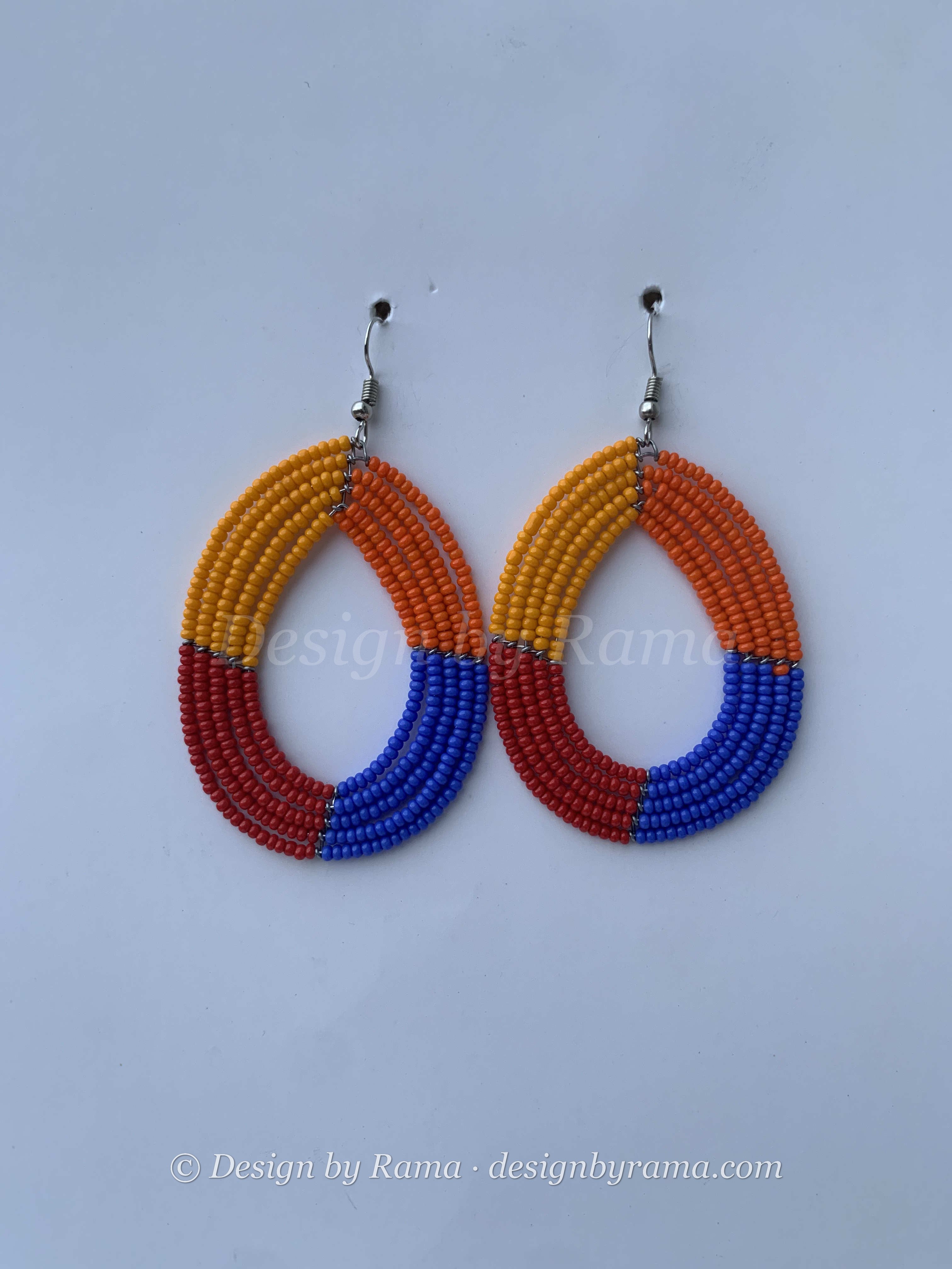 Anyinam Tribal Hoops — handmade orange, red, blue beaded maasai hoop earrings by Rama, Ghana glass beads, Duncan BC