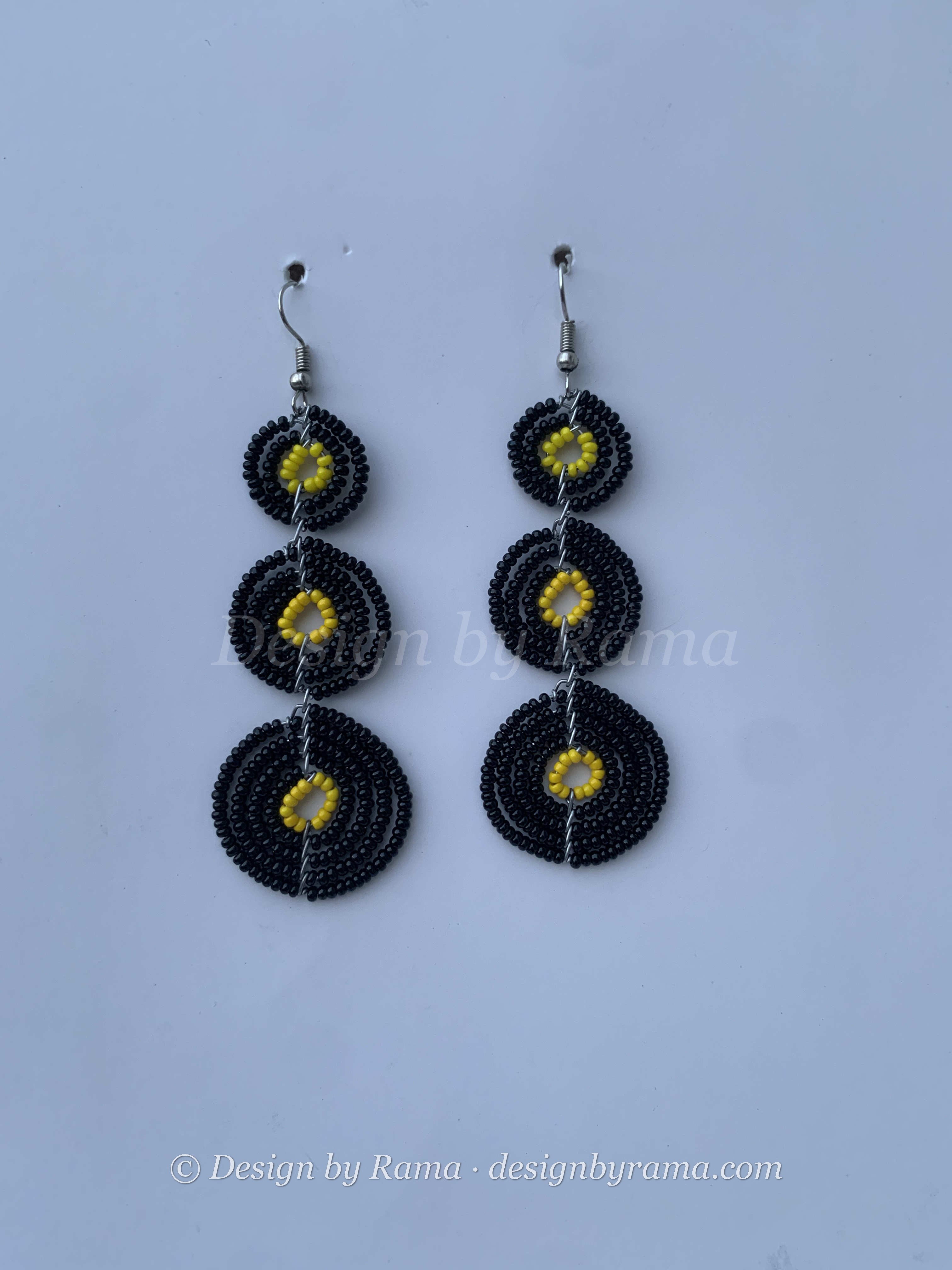Apedwa Midnight Discs — handmade black, yellow beaded maasai earrings by Rama, Ghana glass beads, Duncan BC
