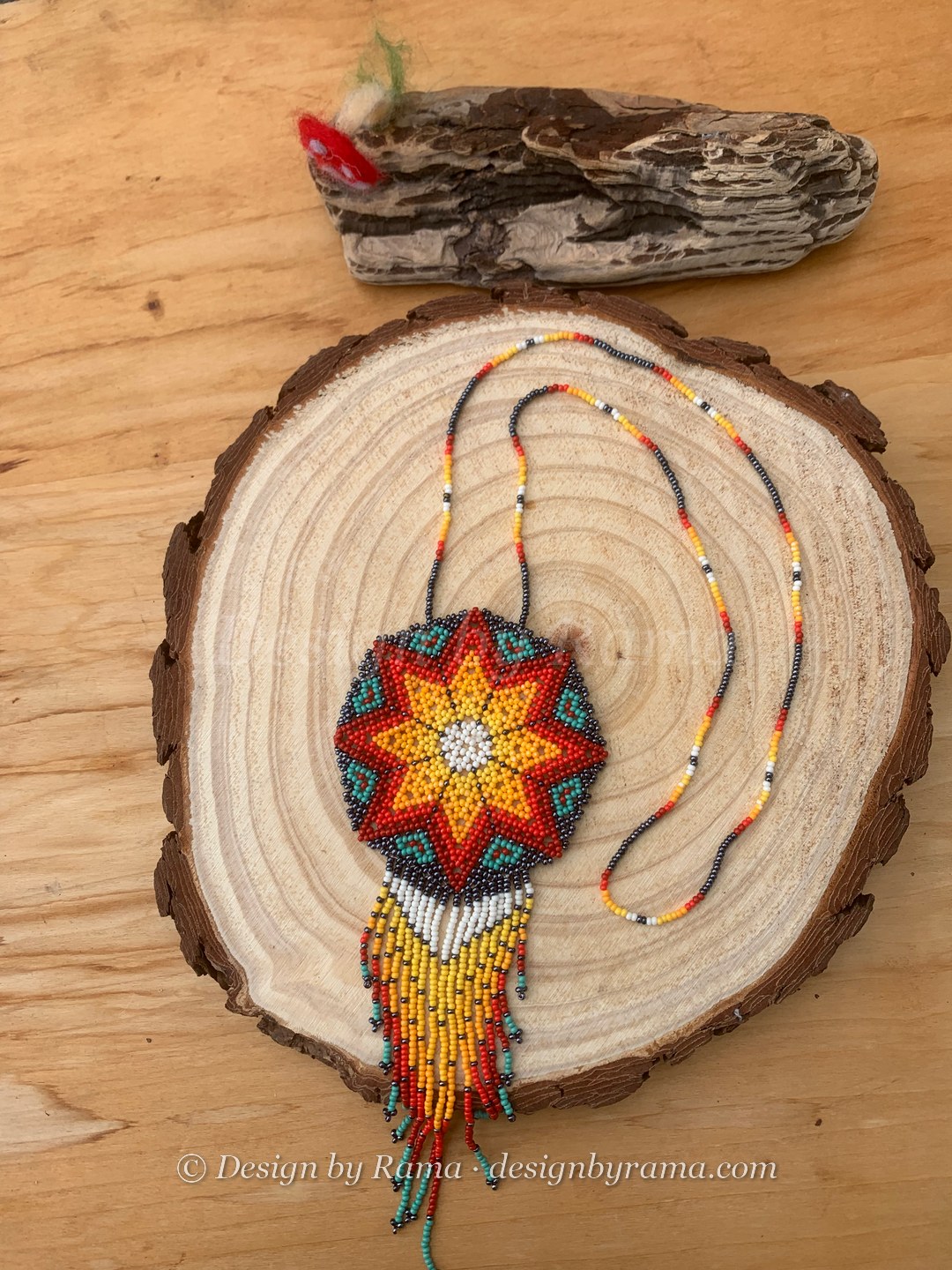 Akosombo Starburst Medallion — handmade orange, red, yellow, teal, white beaded medallion necklace by Rama, Ghana glass beads, Duncan BC