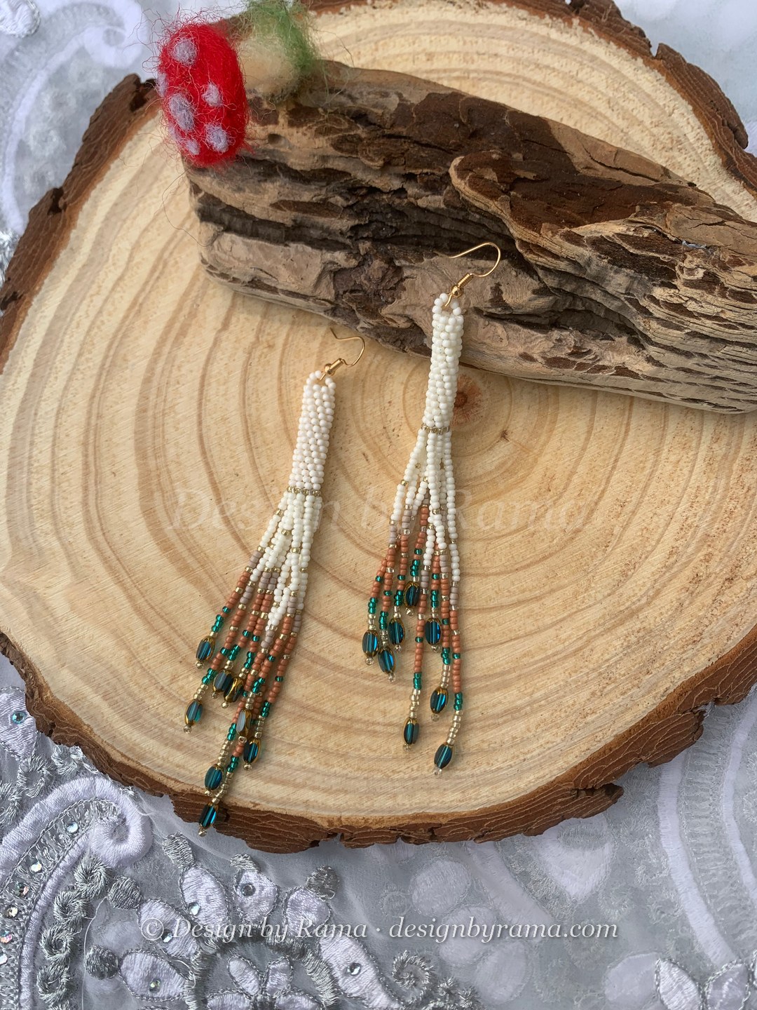 Sege Emerald Drop Fringe — handmade cream, white, emerald green, brown beaded long earrings by Rama, Ghana glass beads, Duncan BC